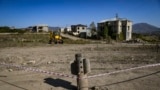 An unexploded, Russian-made BM-30 Smerch rocket is seen on October 12, 2020 in the outskirts of Stepanakert, known to Azerbaijanis as Khankendi, the main town in the breakaway region of Nagorno-Karabakh. Though Russia is a co-chair of the Organization for Security and Cooperation in Europe group coordinating negotiations between Armenia and Azerbaijan, it has sold weapons&nbsp; to both sides of the conflict.